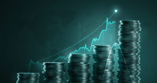 Moedas de prata empilhadas em ordem crescente com gráfico de investimento na cor azul também em ordem crescente, em alusão aos bdrs que pagam dividendos.