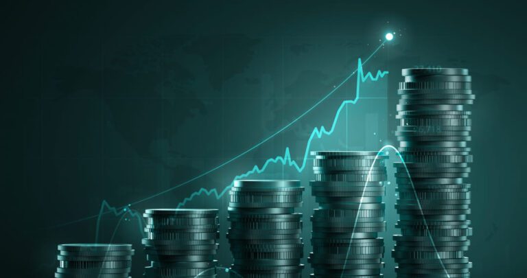 Moedas de prata empilhadas em ordem crescente com gráfico de investimento na cor azul também em ordem crescente, em alusão aos bdrs que pagam dividendos.