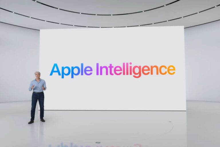Homem em palco com tela exibindo “Apple Intelligence” em cores vibrantes, sugerindo inovação em ações da Apple.