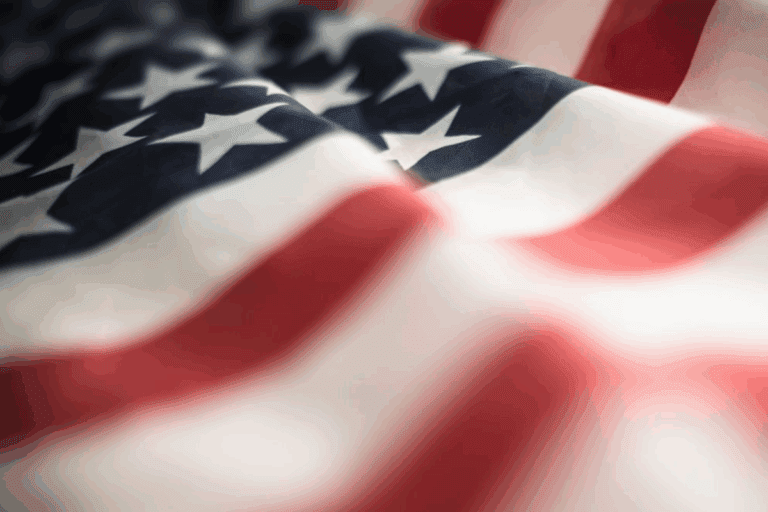 Imagem de uma bandeira dos Estados Unidos com estrelas brancas e listras vermelhas e brancas, destacando o orgulho americano e a nação.
