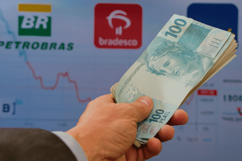 Empresas que pagam dividendos em Setembro. Ilustração com dinheiro/logo das empresas.