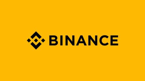 Logo da Binance em fundo amarelo com o nome da exchange de criptomoedas em preto.