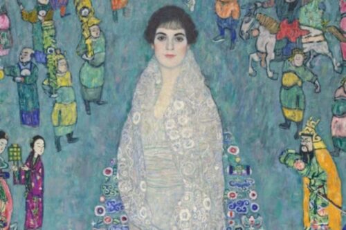 Retrato da Sra. Friderike Maria Beer, uma mulher com cabelo escuro e corte bob, vestindo uma estola branca brilhante com detalhes florais sobre um vestido listrado cinza.